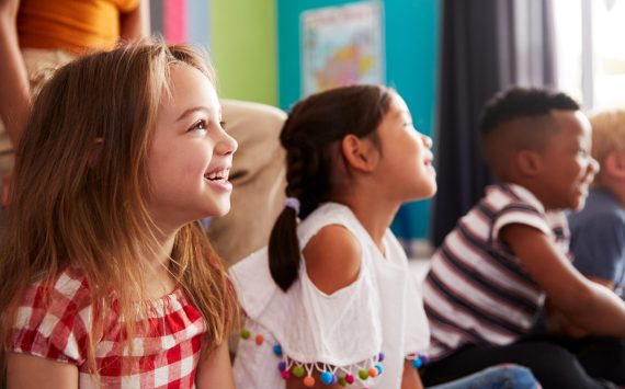 group-of-elementary-school-pupils-sitting-on-floor-2026-01-05-06-27-03-utc (1)