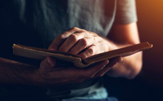 man-reading-a-book-indoors-with-soft-lighting-2026-03-16-00-41-33-utc (1)
